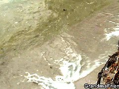 Hot grandma threesome with boys on the beach