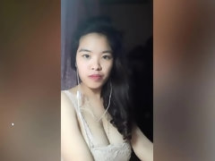 Vietnam  brunette bares her big boobs to play with them