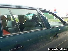 Old bitch takes two cocks outside