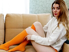 An awesome soloing brunette Lana Tylor stimulates her shaved pussy