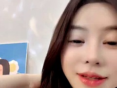 She shows off her body very generously, with a pair of big breasts being kneaded, her tight and fat pussy is pink, and she spreads her legs open for a