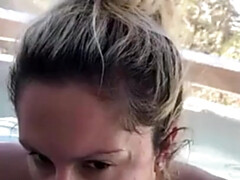 A Woman Blowing A Man In The Pool