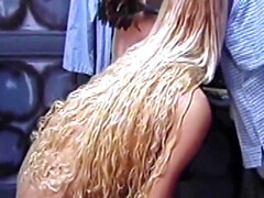 Watch this blonde bombshell in lingerie submit to her mistress's kinky desires