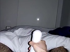 A masked man tries a Fleshlight for the first time