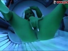 Blonde fingering herself in solarium