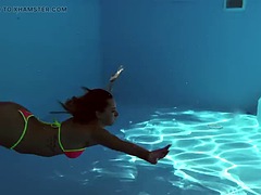 French model enjoys herself underwater